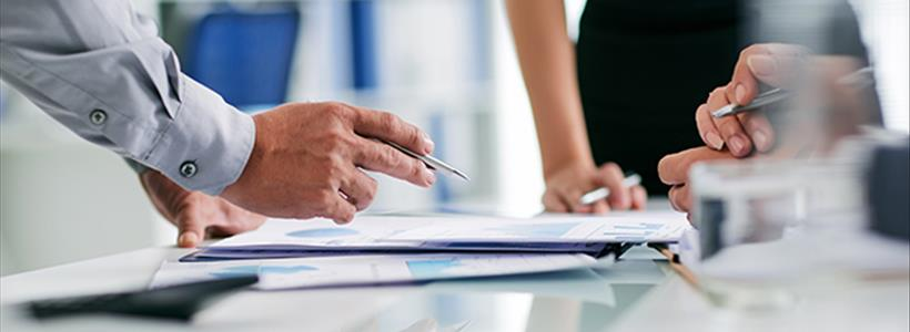 Mechanic inspecting car panel